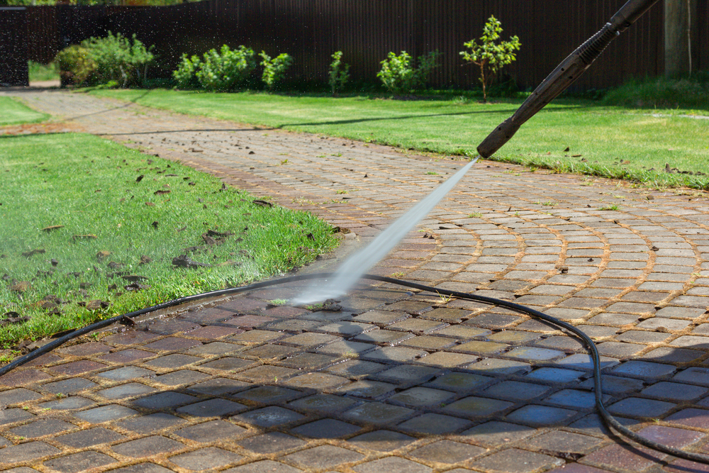 A driveway power washing project completed by Gray's House Services