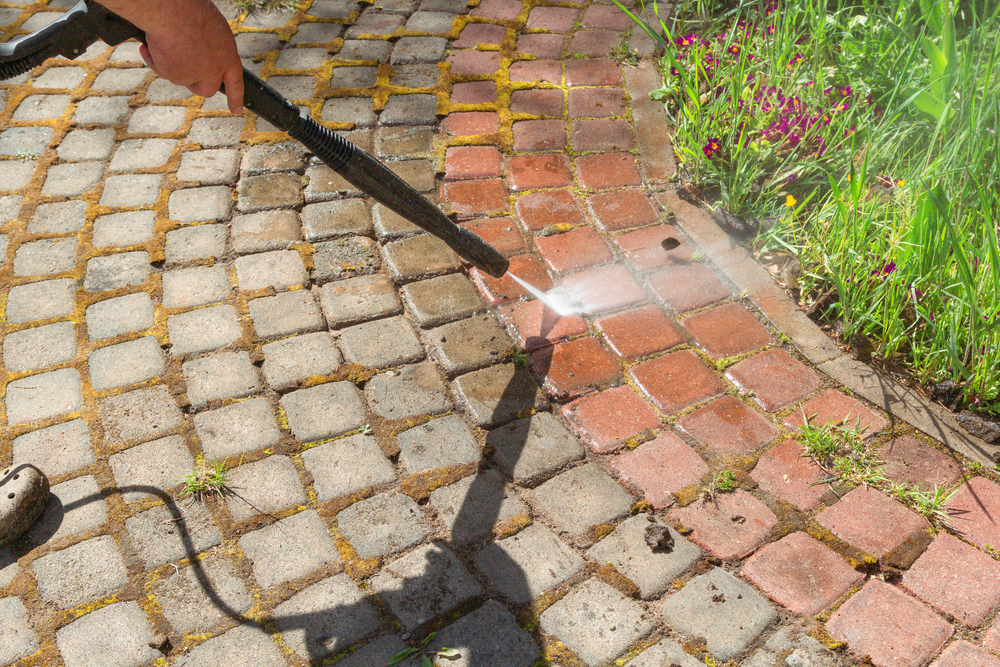A clear before-and-after of a walkway power washing job by Gray's House Services in Nashville, TN